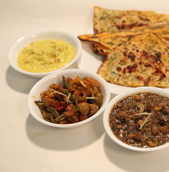 Kadai Paneer + Chana Masala + Raita + Pickle + Salad + 2 Chur Chur Naan